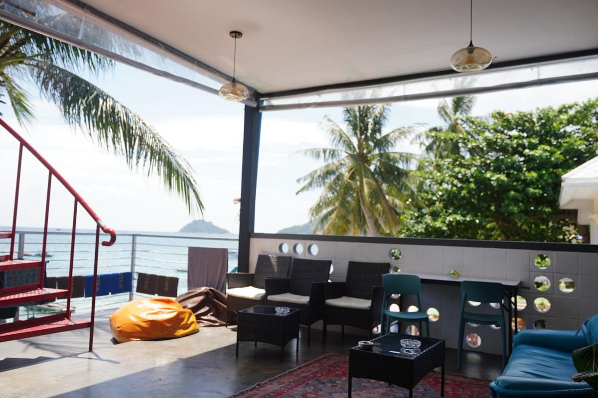 Scuba Square Hostel rooftop chill zone with sea and sunset views